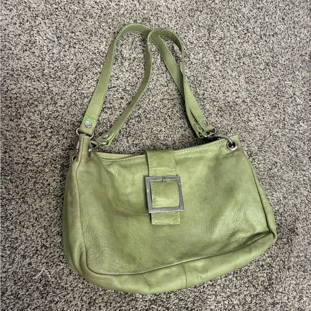Made in Italy. Magnetic closure. 2 lrg inside pockets, 2 sm zip pockets inside